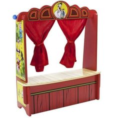 a toy stage with red curtains and dr seuss on the top, in front of a white background