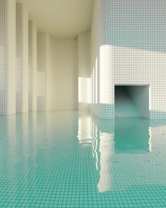 an empty swimming pool with tiled walls and floor