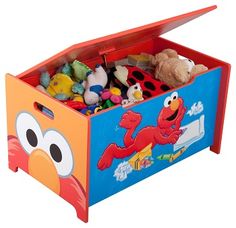 a toy chest with an angry bird design on the front and sides, filled with toys