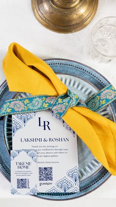 a place setting with yellow napkins and blue plates