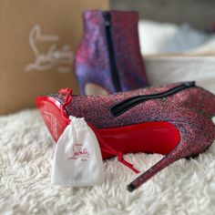 These Boots Have Never Been Worn And Are In Brand New Condition!! The Heels Are About 4 Inches And The Colors Are Absolutely Gorgeous!! (Red And Purple) Dust Bags Included And Extra Heel Tips Along With Box. Luxury Evening Boots With Red Sole, Luxury Heeled Boots With Red Sole And Round Toe, Designer Ankle Boots With Red Sole, Luxury Heeled Boots With Red Sole For Party, Luxury Party Heeled Boots With Red Sole, Luxury Party Boots With Red Sole, Luxury Heeled Boots With Leather Sole For Party, Luxury Party Heeled Boots With Leather Sole, Christian Louboutin Boots