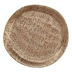 a brown and white plate sitting on top of a table