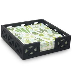 a black tray with green leaves on it