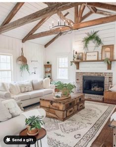 a living room filled with furniture and a fire place in the middle of a room