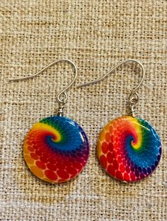 These cute and colorful earrings will go with any style.    Rainbow swirl pattern earrings, its lightweight, and very vibrant.  All earrings are Nickle free and come with rubber backings. Vibrant Rainbow Dangle Earrings, Colorful Vibrant Earrings With Ear Wire, Vibrant Colorful Earrings For Gifts, Fun Rainbow Hypoallergenic Jewelry, Rainbow Colorful Earrings For Gift, Unique Rainbow Earrings, Vibrant Rainbow Drop Earrings, Trendy Colorful Earrings As Gift, Trendy Colorful Earrings For Gift