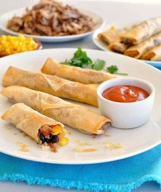 some food is on a white plate with blue napkins and corn in the background