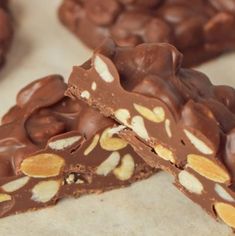 there are many pieces of chocolate with nuts on it