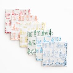 four napkins with different designs on them