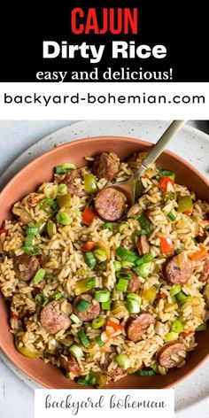 a bowl filled with rice, sausage and vegetables