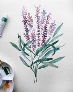 a watercolor painting of purple flowers on a white paper next to paintbrushes