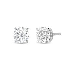 This pair of studs is simplicity redefined. Each earring features a stunning diamond secured by four sleek and elegant claw prongs. View the earrings from the side or at an angle to view the hidden halo that adds extra sparkle to these earrings. Turn to this pair when you want to add an element of glitter to your everyday ensembles. Minimalist Formal Diamond Earrings With Prong Setting, Classic Lab Grown Diamond Earrings, Classic Solitaire Cubic Zirconia Earrings, Modern Single Diamond Round Cut Earrings, Classic Cubic Zirconia Earrings With Prong Setting, Classic Single Diamond White Earrings, Classic Round Cut Lab Grown Diamond Earrings, Minimalist Round-cut Prong-set Earrings, Classic Diamond Earrings With Prong Setting For Formal Occasions