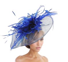 Royal Blue Cobalt Feather Kentucky Derby Fascinator Hat Wedding Cocktail Garden Party Ascot Formal Occasion Races Ladies Woman Headwear Thespian Hat & Fascinator Collection Royal Blue Cobalt Octavia Fascinator Hat Beautiful royal blue cobalt silk flower trimmed with royal blue feathers on a large sinamay base  Measures about 14 inches wide This royal blue cobalt headpiece is mounted with a matching headband. If you prefer a headband to match your hair, please make a note at check out what colour Blue Costume Hats And Headpieces For Spring Evenings, Blue Feather Fascinator For Summer, Blue Feathered Fascinator For Summer, Adjustable Royal Blue Fascinator For Spring, Blue Feathered Summer Fascinator, Royal Blue Mini Hats For Royal Ascot Evening, Spring Royal Blue Adjustable Fascinator, Blue Feathered Costume Hats And Headpieces For Spring, Formal Blue Costume Hats And Headpieces For Spring