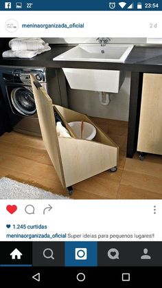 a washer and dryer in a room with wood flooring on the ground