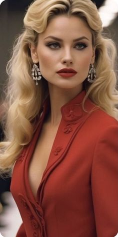 a woman in a red dress with long blonde hair and big earrings on her head