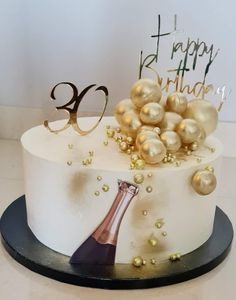 a birthday cake with a bottle of champagne and pearls on the top is for someone's 30th birthday