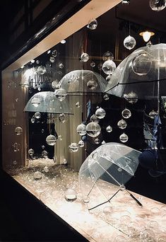 there are many umbrellas in the store window