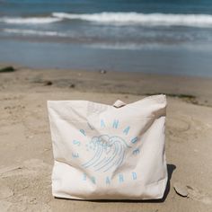 Our new oversized beach tote is perfect for carrying all of your gear down to the sand. Fill it with snacks for the kiddos, bring it to the farmers market, or use it for a daily adventures. Printed with our Shore Break design in a cool ocean blue. 20"W x 15"H x 5"D 100% heavy cotton canvas Bottom gusset 23" web canvas handles 10" handle drop Playful Tote Beach Bag For Shopping, Playful Tote Beach Bag, Playful Beach Tote Bag, Eco-friendly Canvas Beach Tote Bag, Eco-friendly Canvas Tote Bag For Beach Season, Brazil Beaches, Beachy Room Decor, Cafe Idea, Canvas Beach Tote