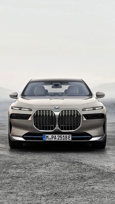 the front end of a silver bmw concept car