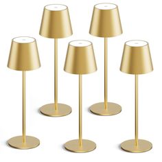 four gold lamps are shown in three different positions