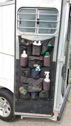 the inside of a horse trailer filled with toiletries and grooming products on wheels