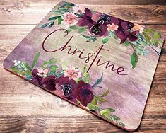 a personalized mouse pad with flowers and the word, cuisine on it's side