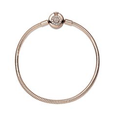 Bring some sparkle to every moment with the Pandora Moments Sparkling Crown O Snake Chain Bracelet. Hand-finished in 14K rose gold-plating, the bracelet's clasp features the iconic Pandora crown O monogram and bead-set clear cubic zirconia pavé, while the snake chain brings a chic and modern touch to your wrist. Stack it with other bracelets and load it up with favorite charms for a piece you'll reach for over and over. Rose Gold Charm Bracelet With Jubilee Bracelet, Rose Gold Charm Bracelet With Jubilee Detail, Rose Gold Jubilee Charm Bracelet, Rose Gold Round Bracelets With Charms, Luxury Sparkling Rose Gold Jewelry, Elegant Rose Gold Charm Bracelet With Lobster Clasp, Luxury Rose Gold Bracelets With Sparkling Stones, Luxury Rose Gold Diamond Bracelet With Sparkling Stones, Rose Gold Diamond Bracelet With Sparkling Stones