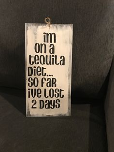 a sign that says i'm on a tequila diet so far we lost 2 days