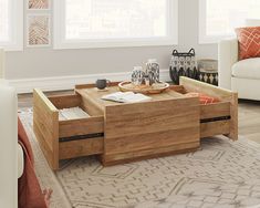 a wooden coffee table with drawers on top