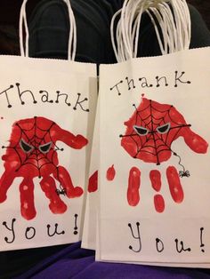 two bags with handprints on them that say thank you