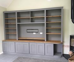 a room with some shelves and cabinets in it