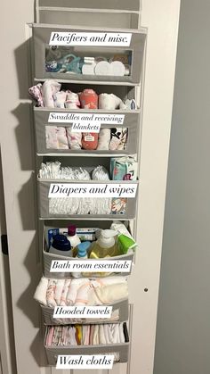 an over the door storage unit with lots of diapers and wipes on it