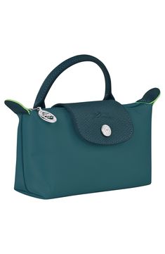 Textured leather trim adds a signature finishing touch to this durable nylon case that's perfectly proportioned for securing your cosmetics while on the go. Water-resistant lining Textile with leather trim Imported Longchamp Le Pliage Green, Longchamp Leather, A Signature, Recycled Canvas, Cosmetic Case, Longchamp Le Pliage, Travel Luggage, Leather Trims, The Go