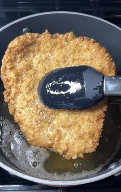 a frying pan with some food cooking in it