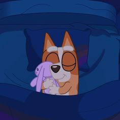 a dog with glasses and a toy in its mouth is hiding under the covers on a bed