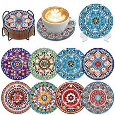 several colorful plates with designs on them and a cup of coffee in the middle one