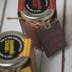 two jars of chili paste with labels on them