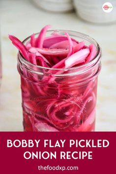 a mason jar filled with pickled onion slices