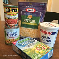 three containers of frozen food on a table