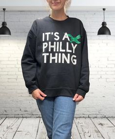 Elevate your Eagles fandom with our 'it's a Philly thing ' crewneck sweatshirt. Show your team spirit in style with this cozy gildan sweatshirt.  Crafted for comfort and pride, this shirt is made with the softest materials, ensuring a cozy fit all day long. We offer a range of sizes to suit every fan, from small to 2XL, so you can find the perfect fit. Whether you're gearing up for game day at the stadium or simply want to represent your beloved Eagles in everyday life, our 'It's a Philly Thing' Trendy Crew Neck Sweatshirt For Fan Merchandise, Its A Philly Thing, Philly Sports, Gildan Sweatshirt, Gildan Sweatshirts, Cozy Fits, Philadelphia Eagles, Team Spirit, Team Colors