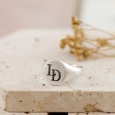 A personalised solid silver initial ring is a timeless essential piece of jewellery that holds sentimental value. This unique custom-engraved solid silver signet ring is perfect for a milestone birthday, such as an 18th or 21st birthday gift for a son or grandson. I deeply custom engrave overlapping monogram initials, with the option for an additional inside engraved message on the back of the ring face. The silver ring is solid throughout; the back is not hollow and is hallmarked in the UK for Classic Sterling Silver Monogram Rings, Classic Sterling Silver Rings With Monogram, Classic Silver Initial Ring With Monogram, Sterling Silver Monogram Initial Ring Minimalist Style, Classic Silver Monogram Ring, Sterling Silver Monogram Rings, Minimalist Monogram Silver Ring, Minimalist Silver Monogram Ring, Classic Silver Ring With Monogram