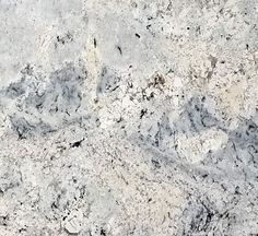 an image of white marble textured with black and grey accents on the counter top