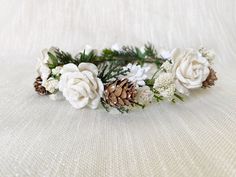 This is the perfect Christmas crown to add some holiday cheer. This halo is custom made with various greenery, babies breath and has a variation of white roses and pine cones placed perfectly on a natural twine. All of the flowers are handmade from mulberry paper. This halo is custom made to fit your preferred size and so please select the size you would like from the drop down menu at checkout. Sizing Options: Newborn - 13.5 inches circumference 0-3 Months - 16 inches circumference 3-6 Months - Winter Floral Crown, Winter Flower Crown, Winter Flower Girl, Christmas Wedding Flowers, Flower Girl Headpiece, Antlers Decor, Headpiece Flower, Baby Flower Crown, Pink Flower Crown