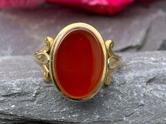 A very stylish and traditional signet ring in 9ct yellow gold set with a blank Carnelian stone Finger size M 1/2 or 6 3/4 US Full hallmarks for Birmingham 1994 In excellent condition Will arrive gift boxed Free tracked shipping/UK next day delivery. Classic Yellow Gold Signet Ring With Cabochon, Classic Carnelian Signet Ring For Anniversary, Classic Carnelian Signet Ring With Polished Finish, Classic Carnelian Signet Ring For Formal Occasions, Classic Carnelian Signet Ring For Formal Events, Gold Carnelian Signet Ring With Polished Finish, Formal Gold Carnelian Ring, Formal Carnelian Gold Ring, Classic Round Carnelian Signet Ring