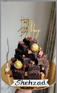 a birthday cake made to look like a pile of brownies