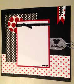 a mickey mouse photo frame with red and white polka dots on it, attached to a wall