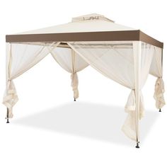 a white and brown canopy bed with curtains on it's sides for privacy from the sun