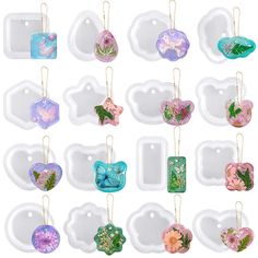 twelve assorted flower shaped tags hanging from strings