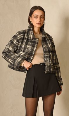 Black and white, plaid jacket with a zipper closure. The collared garment features a square-like strcuture with two front pockets. Jacket Plaid Zipper Closure Lined Length: 20 3/4" Chest: 21" Self: 100% Polyester Lining: 100% Polyester Hand wash in cold water with similar colors. Model is wearing a size small Style #: G247J1749 Plaid Shacket, Perfect White Tee, Cozy Jacket, Winter Fit, Sweater Jumpsuit, Fashion And Makeup, Black And White Plaid, Mother Denim, Jacket Outfit