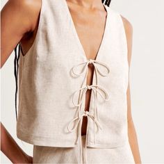 Nwt Abercrombie & Fitch Linen-Blend Tie-Front Vest Top. Color Is Light Beige. Wrap Shirt Pattern, Tie Front Vest, Womens Matching Sets, Linen Tank Top, Bow Top, Nike Tennis Dress, Linen Tank, Boho Chic Outfits, Pattern Sweater