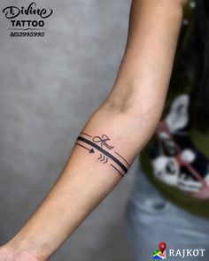 a woman's arm with a tattoo on it and an arrow in the middle